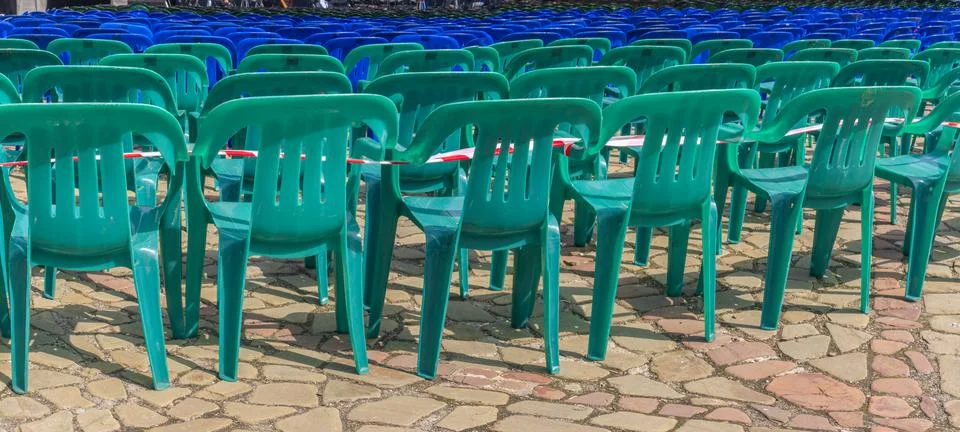 Vacant empty plastic chairs pattern. A lot of chairs for spectators. Comforta Stock Photos