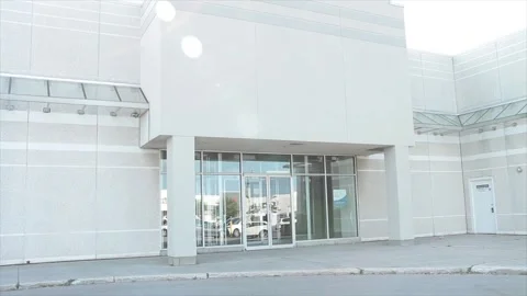 Vacant generic empty store storefront beige white clean with no sign or logo Vídeo Stock 249757673