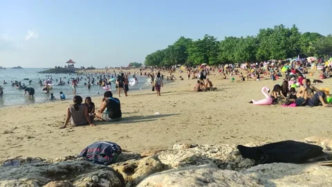 Vacation and bathing at Sanur Beach, Bali, Indonesia on May 22, 2022 Видео 199763040