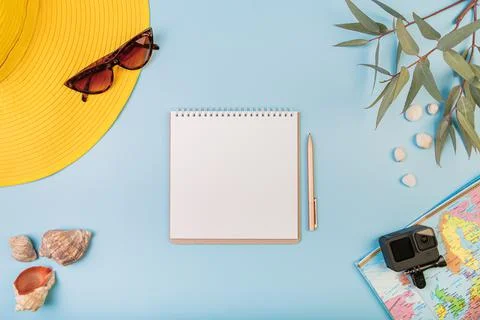 Vacation on beach, layout of natural elements, maps, action cameras and hats, a Stock Photos