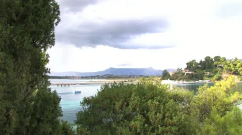 Vacation boat sailing between the trees in Corfu island Stock Footage 17866898