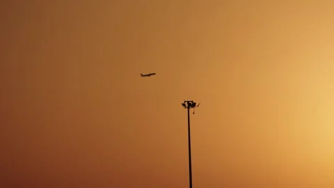 Vacation concept. Airplane passing by the sun. Silhouette a plane flying Stock Footage 293737353