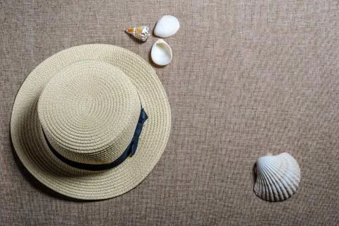 Vacation flat view with straw hat and sea shells Stock Photos