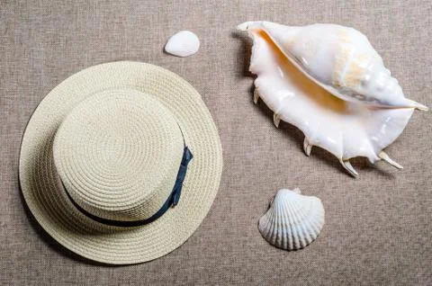 Vacation flat view with straw hat and sea shellssea shells Stock Photos