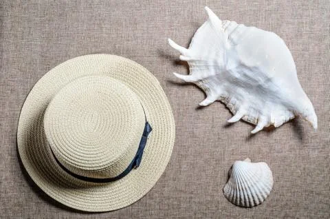 Vacation flat view with straw hat and sea shellssea shells Stock Photos