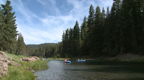 Vacation Float Trip Down a California Mountain River Stock Footage 54715447