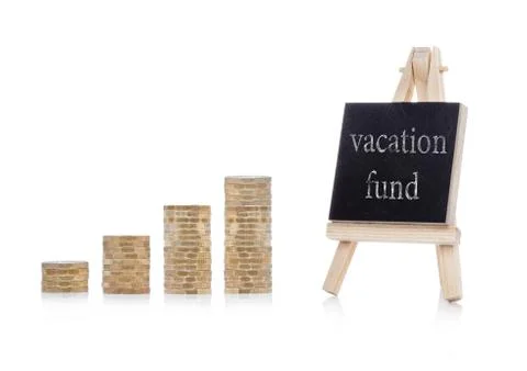 Vacation fund plan concept text on chalkboard  with coins on white background Stock Photos