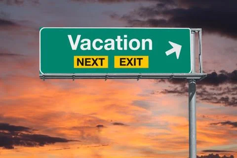 Vacation Next Exit Freeway Sign with Sunset Sky Stock Photos