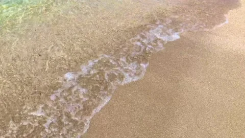Vacation. relaxation. close up of sea waves flow to the sandy shore. Stock Footage 156511624