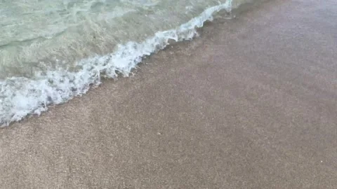 Vacation. relaxation. sea waves flow to the sandy shore. close up view Stock Footage 156511602