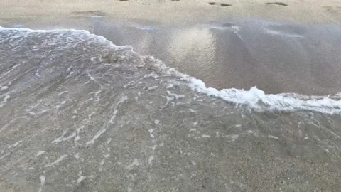 Vacation. relaxation. sea waves flow to the sandy shore Stock Footage 156511615