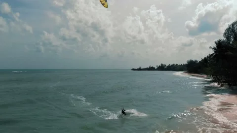 Vacation style people practicing kite surfing and windsurfing on deep blue sea Stock Footage 229677490
