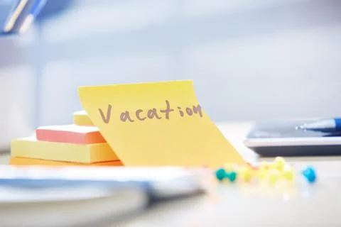 Vacation text on adhesive note Stock Photos