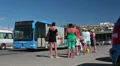 Vacationers awaiting departure bus on stop of Coral Bay beach, Paphos, Cyprus HD Footage