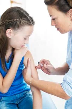 Vaccinating a child Stock Photos