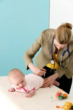 Vaccinating an infant Stock Photos