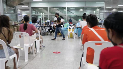 Vaccination center, waiting queue of Thai people, Bang Sue, Bangkok, Thailand Stock Footage 161810260