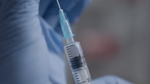 Vaccination kit in a macro syringe Stock Footage 148006796
