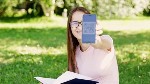 Vaccination qr code covid-19 for teenagers,student shows vaccine certificate Stock Footage 157051423