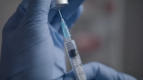 Vaccination syringe macro Stock Footage 148009617