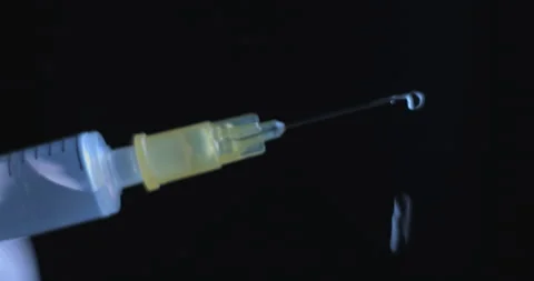 Vaccine syringe slow motion macro close up  studio in 4K, prores HQ, Covid-19 Video stock 144960153