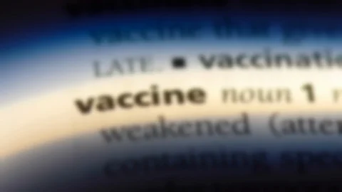 Vaccine word in a dictionary. Stock Footage 99562669
