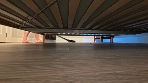 Vacumming underneath a bed. Stock Footage 340449666
