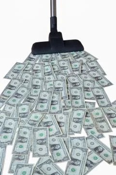 Vacuum cleaner and dollar notes Stock Photos