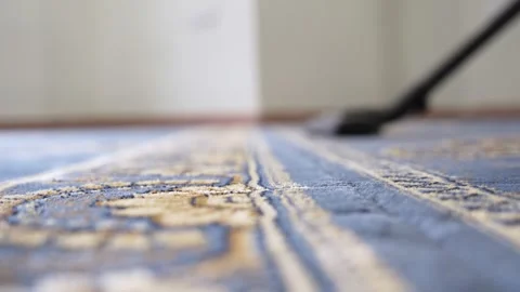 Vacuum Cleaner Cleaning Blue Patterned Carpet Stock Footage 336356052