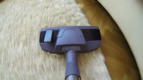 Vacuum cleaner cleaning the carpet. Stock Footage