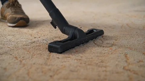 Vacuum cleaner cleaning the carpet. Stock Footage 98999399