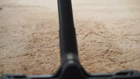 Vacuum cleaner cleaning the carpet. Stock Footage 99000141