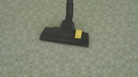 Vacuum-cleaner-head-moving-on-carpet-front-view Stock Footage 344942852
