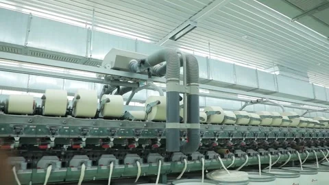 The vacuum cleaner moves over the spools of thread 2 Stock Footage 229946811