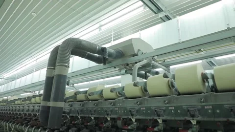 The vacuum cleaner moves over the spools of thread Stock Footage 229947157