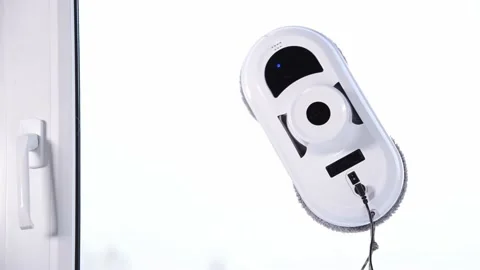 Vacuum cleaner robot washing window on white background. Video stock 157649628