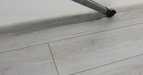 Vacuum cleaner rolling from side to side on a parquet floor 스톡 동영상 103355444