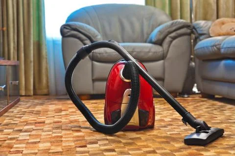 Vacuum cleaner in room Stock Photos