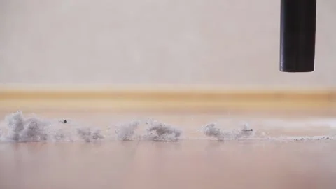 Vacuum cleaner sucks up large clouds of dust close-up Stock Footage 166992461