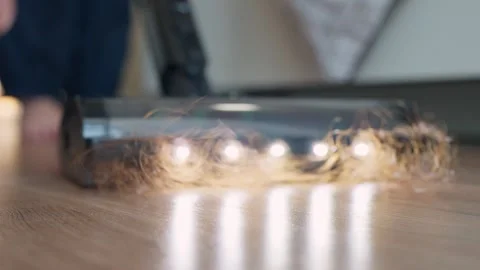 An vacuum cleaner suctioning a large amount of fallen hair on the floor at home. Stock-Footage 327847189