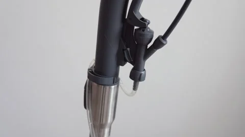 A vacuum cleaner with a wet cleaning function is in the room. View of the handle Stock Footage 154060886
