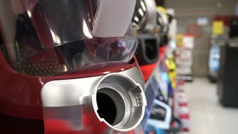 Vacuum cleaners on the shelf of a hardware store Stock Footage 267592760