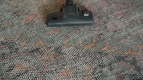 Vacuum cleaning closeup. Duster head moving across carpet fibers slowly Stock Footage 336863916