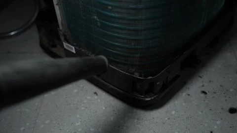Vacuum cleaning dust from air conditioner unit, Close-up of a vacuum hose c.. Stock Footage 338319425