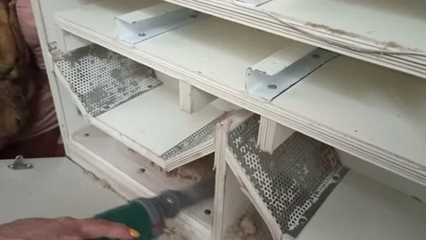 Vacuum cleaning of the insides of the machine for cleaning down into pillows Stock Footage 164972277