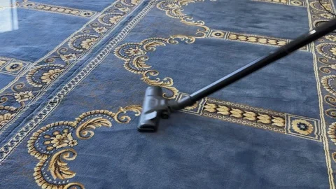 Vacuum Cleaning Patterned Blue Carpet Stock Footage 341717413