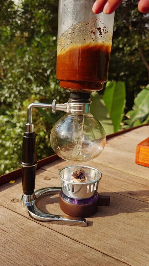 Vacuum Coffee Brewing Process With Specialty Equipment and Tropical Background, Stock Footage 336798852