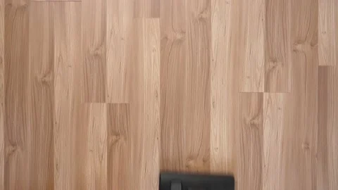 Vacuum the floor with laminate view from above. Stock Footage 150118957