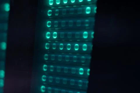 Vacuum fluorescent display segments in clock, macro. Stock Photos