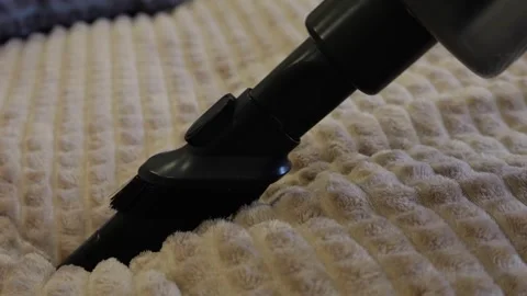 Vacuum Nozzle Glides Over Beige Rug Surface. Suction Action Lifts Dirt From Видео 330396337
